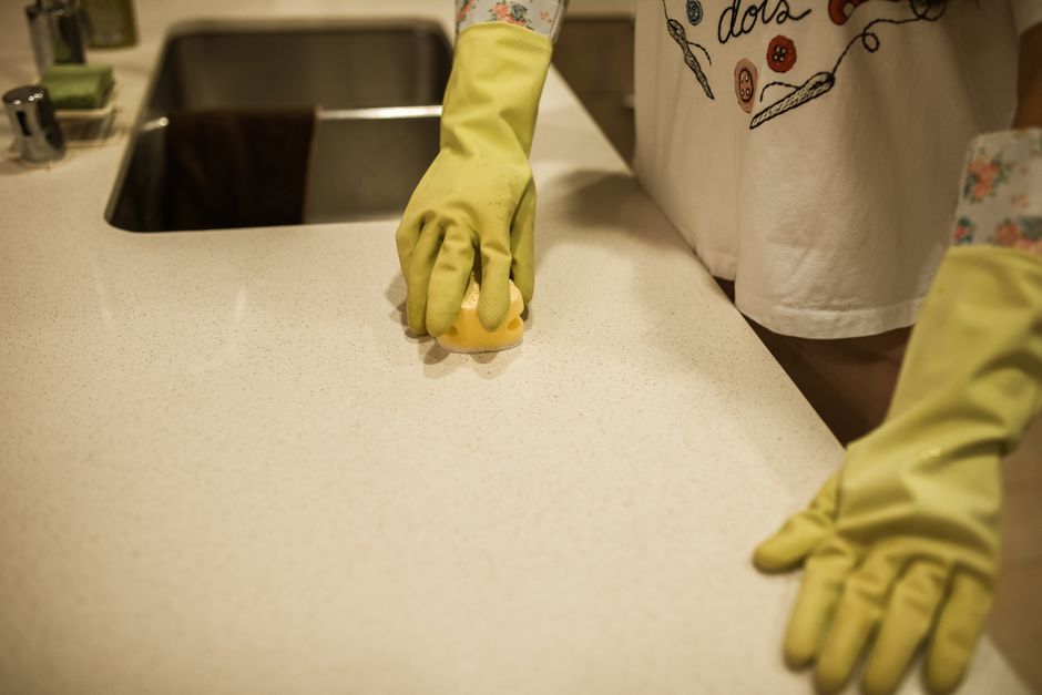 Wiping kitchen counter sponge
